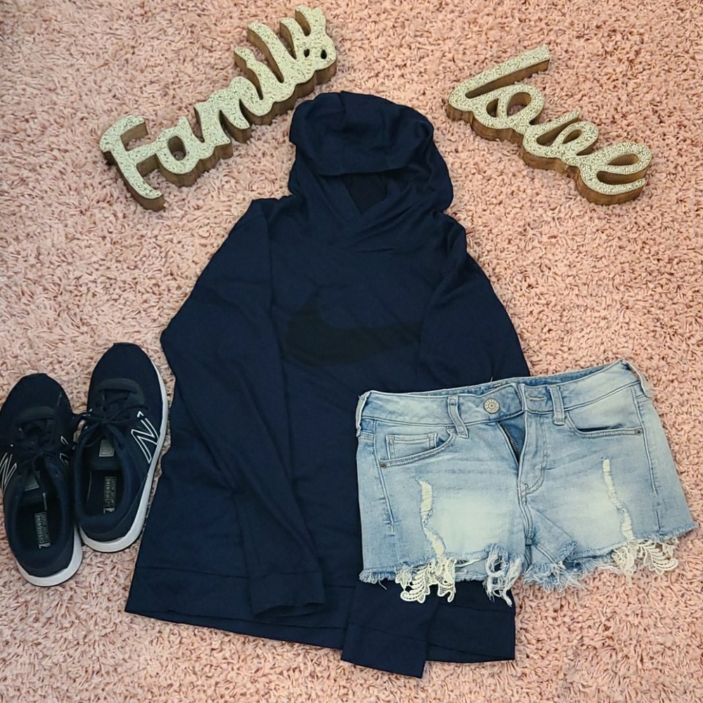 Nike navy blue hooded long sleeved shirt.